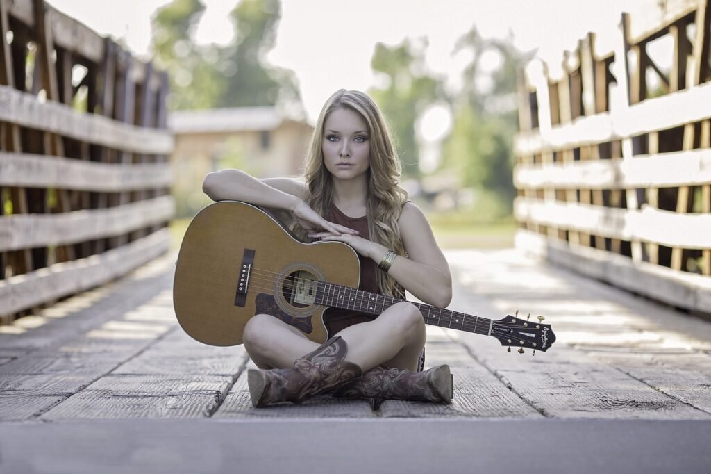 woman, guitar, bridge-944261.jpg